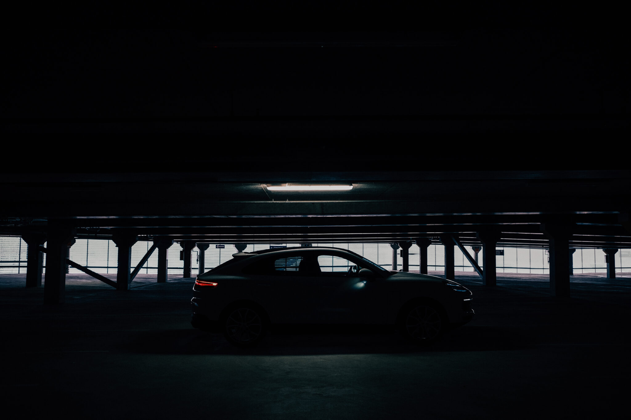 Sports car in parking garage. Cinematic